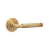 brass lever handle on round rose with escutcheon for doors