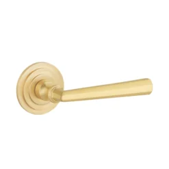 brass lever handle on round rose with escutcheons for interior and main doors