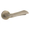 modern lever handle on round rose with escutcheons for interior doors
