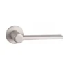modern lever handle on round rose with escutcheon for interior doors